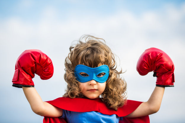 Superhero kid. Girl power concept Powerful blogging combo