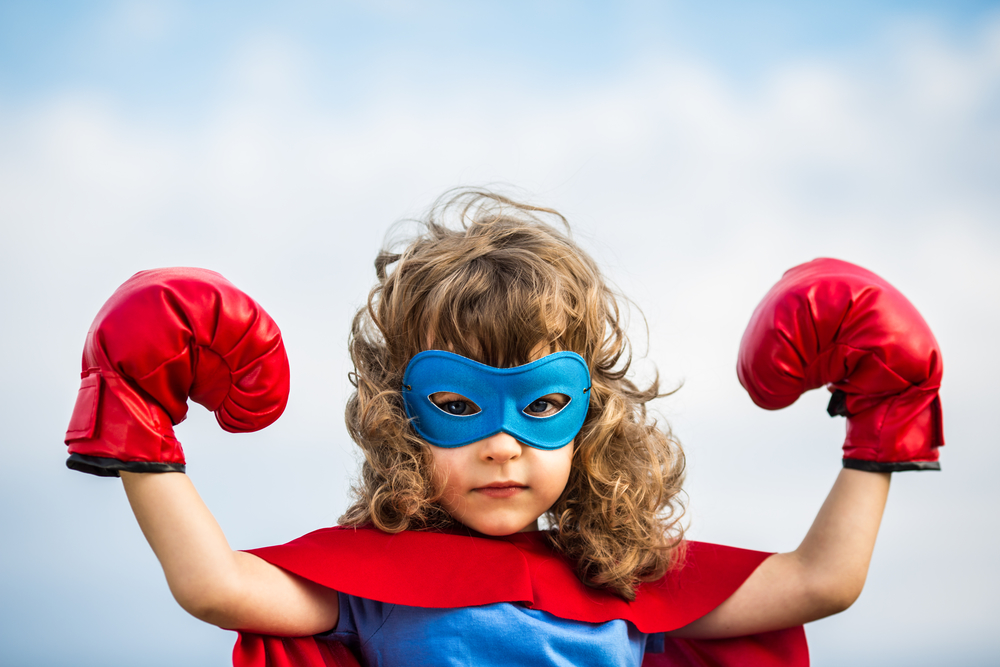Superhero kid. Girl power concept Powerful blogging combo